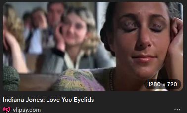 screenshot of the first indiana jones. student with LOVE YOU written on her eyelids.