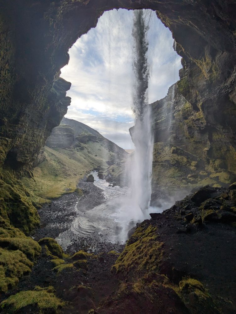 Photo of Kvernufoss waterfall from behind.

I took this photo on a recent trip to Iceland.

Kvernufoss is a smaller lesser known waterfall in the same village as Skógafoss, one of Iceland's most iconic waterfalls. Definitely worth the short hike!