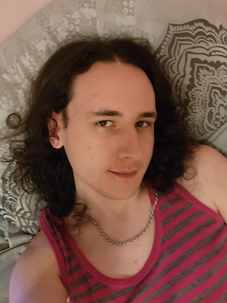 Jasmine is lying on the bed with her nightgown on