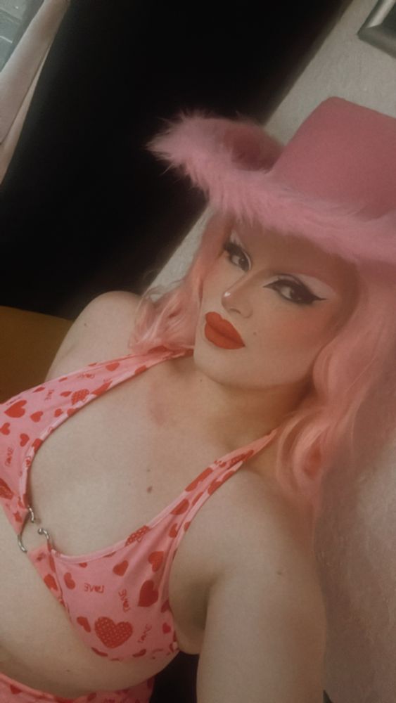 Jacqueline wearing a bikini and pant combo in all pink pattern for a country western weekend cabaret