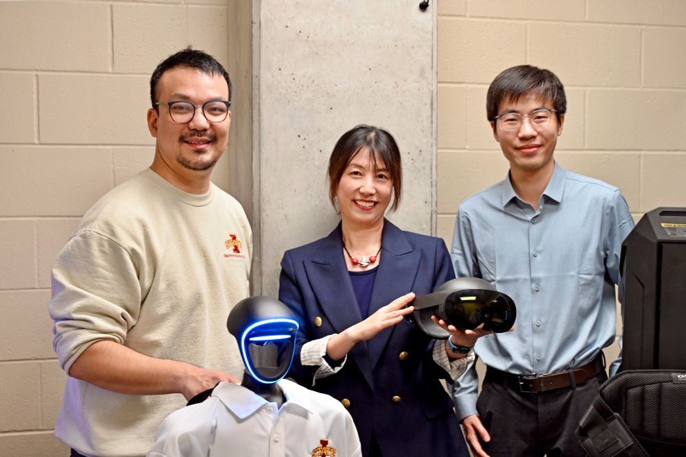 Bowen Weng, E.J. Bahng, and Jundi Liu holding robotics and virtual reality equipment used in their project.