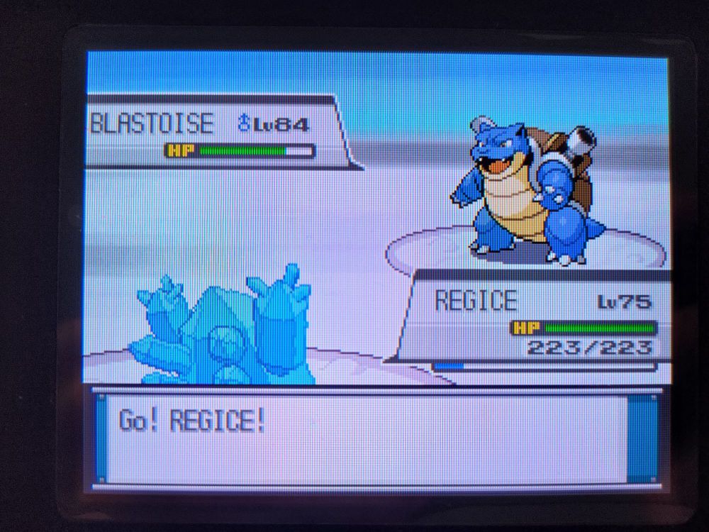 shiny REGICE is sent out into battle against RED's BLASTOISE. Regice raises its hands into the air as if delighted to be taking part.