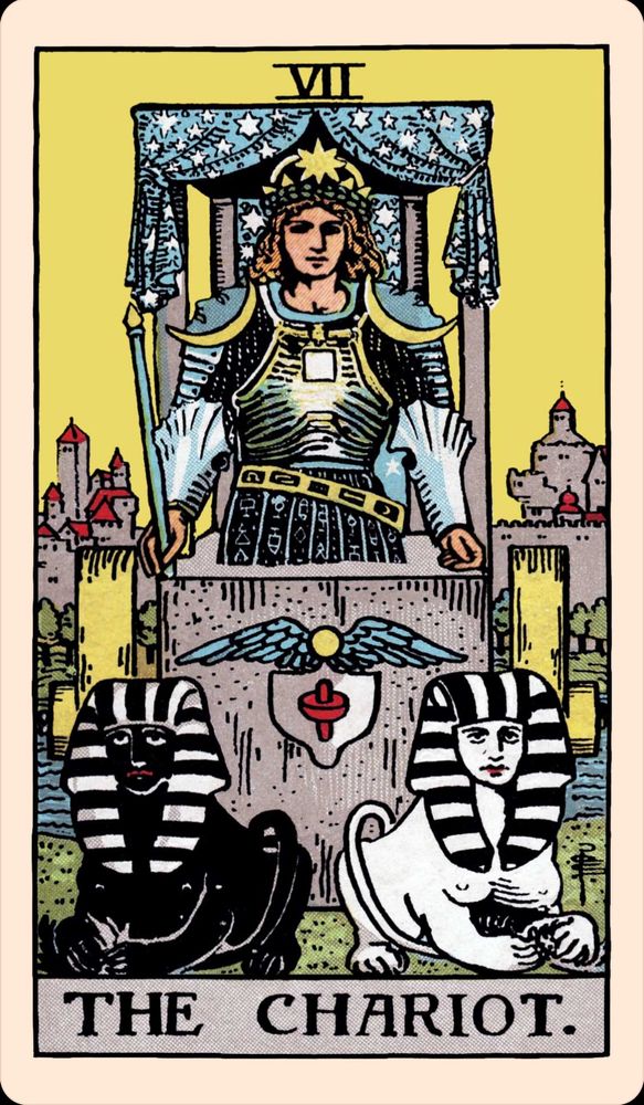 A tarot card: 7, The Chariot. A young, armored king drives a chariot pulled by two sphinxes, one black and one white. There are no reigns. A blue canopy with stars is above him. A city is behind him, bathed in sunlight. On the chariot is a symbol of a shield with wings.