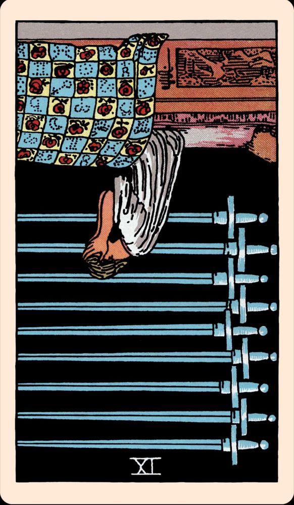 A tarot card: Nine of Swords. A person is sitting up in bed with their head in their hands. On the dark wall behind them hangs nine swords pointing to the right. This card is upside down. 