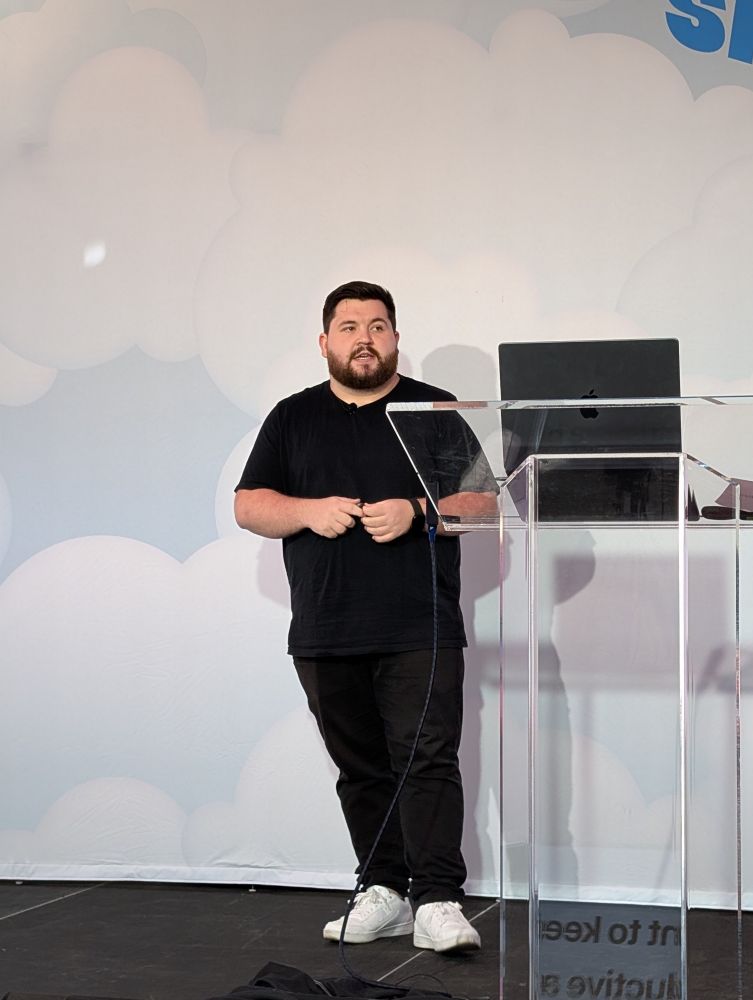 Marco on stage looking serious.