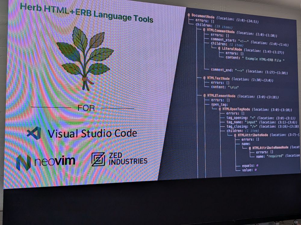 Terribly distorted slide from the camera angle and sun hitting the screen of the Herb logo and parsed output of a template.