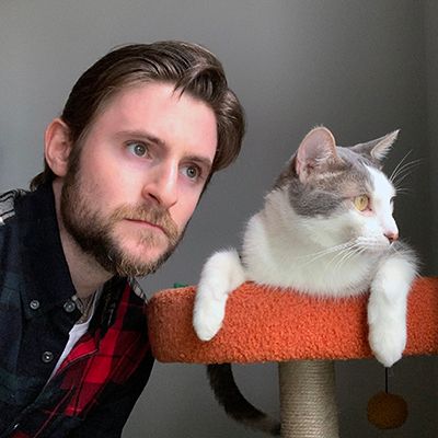 Ben Becker with his cat, Salamander.
