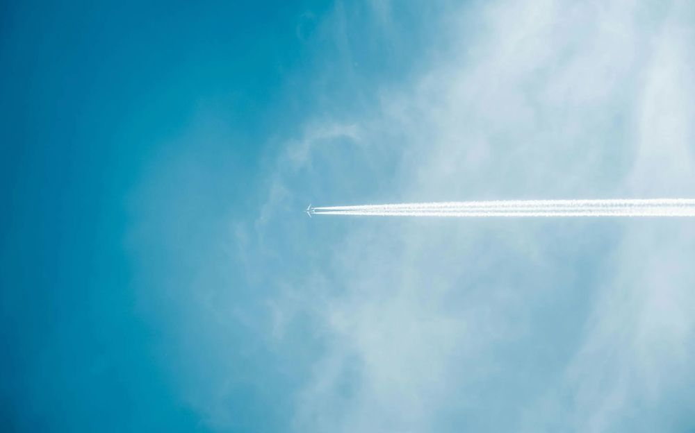 Blue sky with aeroplane trail