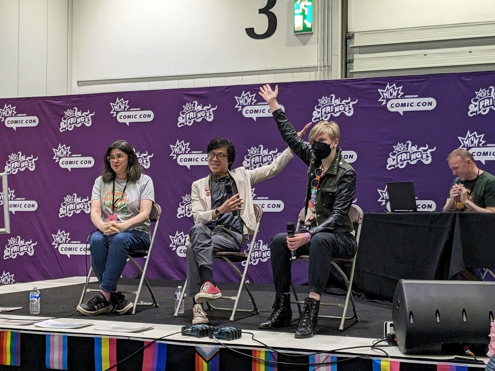 Mira, Sam, and I on the Fringe Stage, Sam is gesturing to me and I have my hand up
