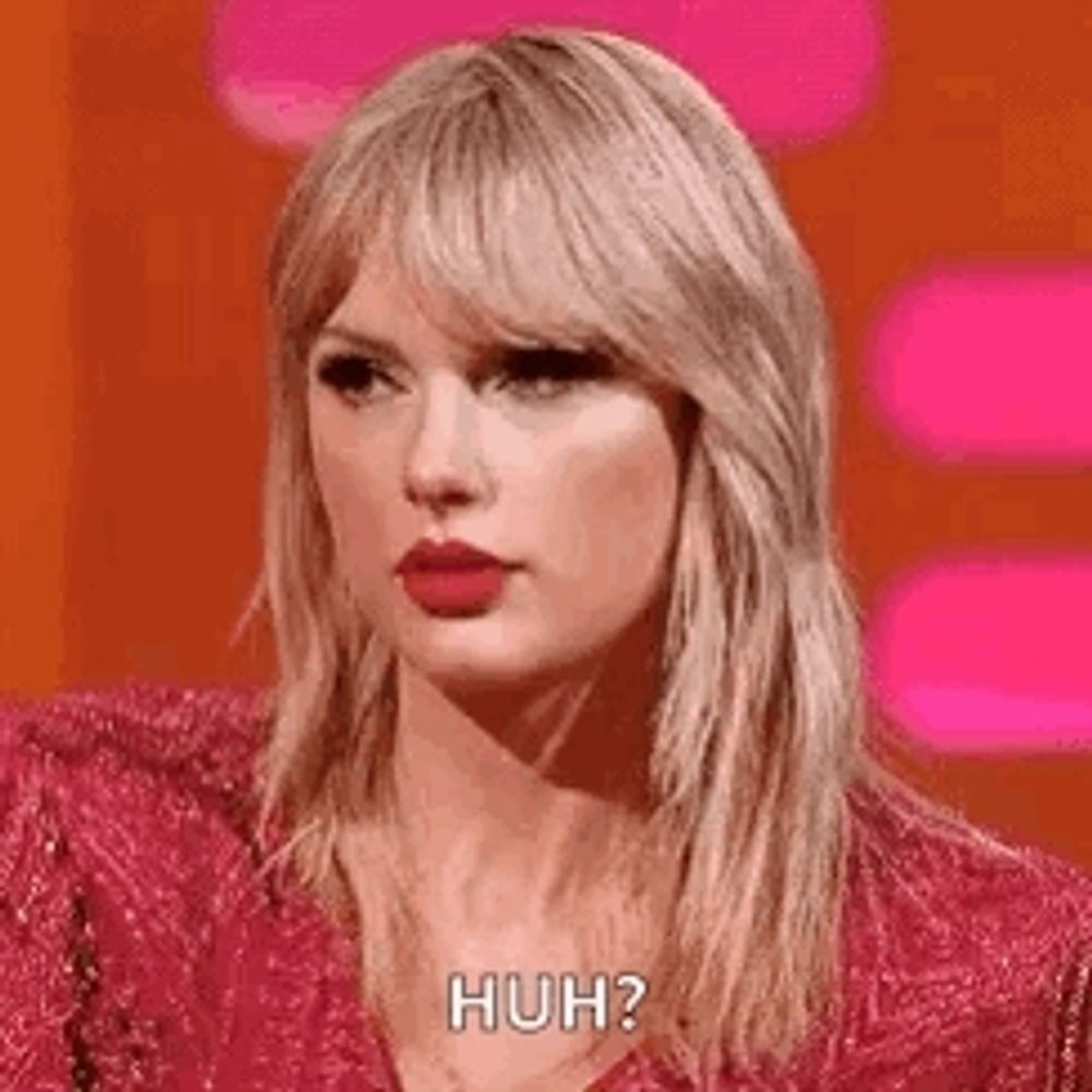 taylor swift is wearing a pink dress and making a funny face while talking on a show .