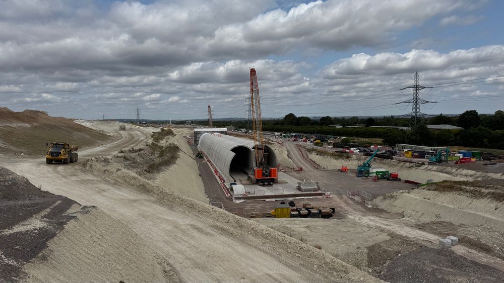 An area with intense construction, including a partly built tunnel, currently exposed