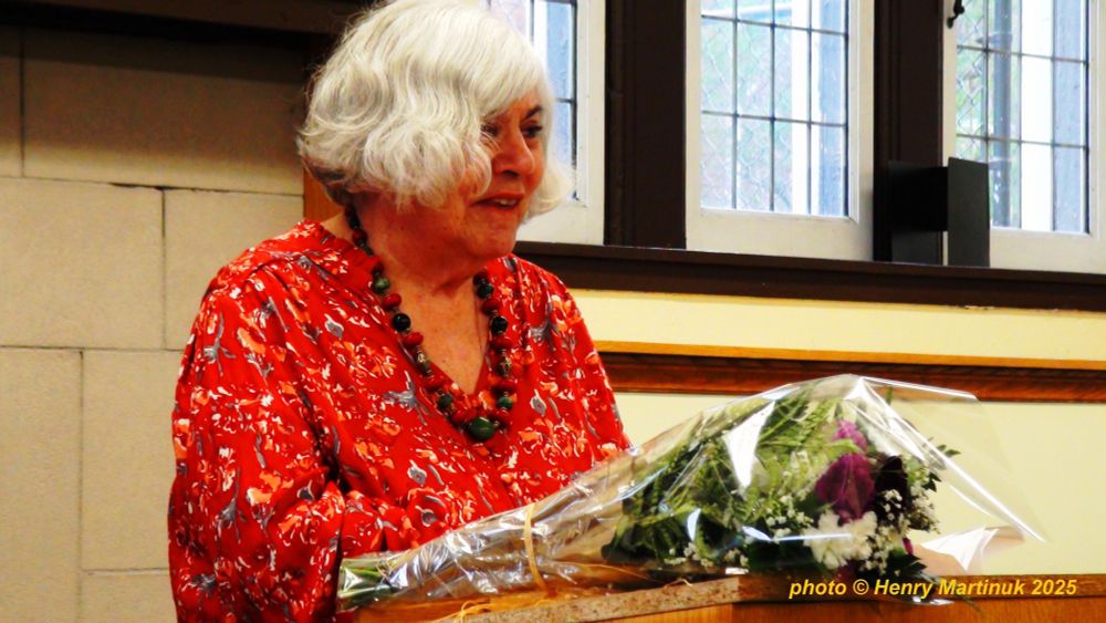 Elizabeth read in the same lovely red blouse she wears in her author photo.