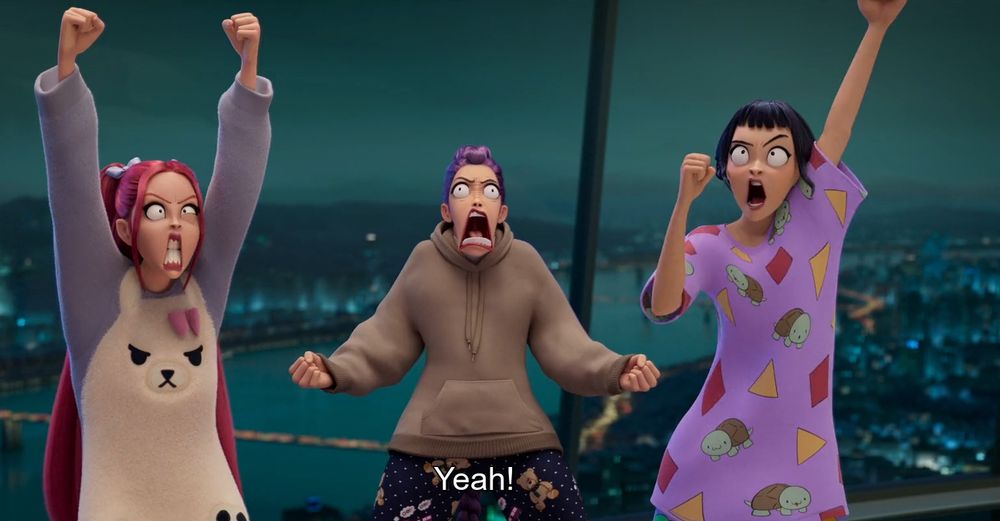 Screen shot from Kpop Demon hunters showing the three main characters, Rumi, Mira, and Zoey shouting "Yeah!"while making intense silly expressions.  