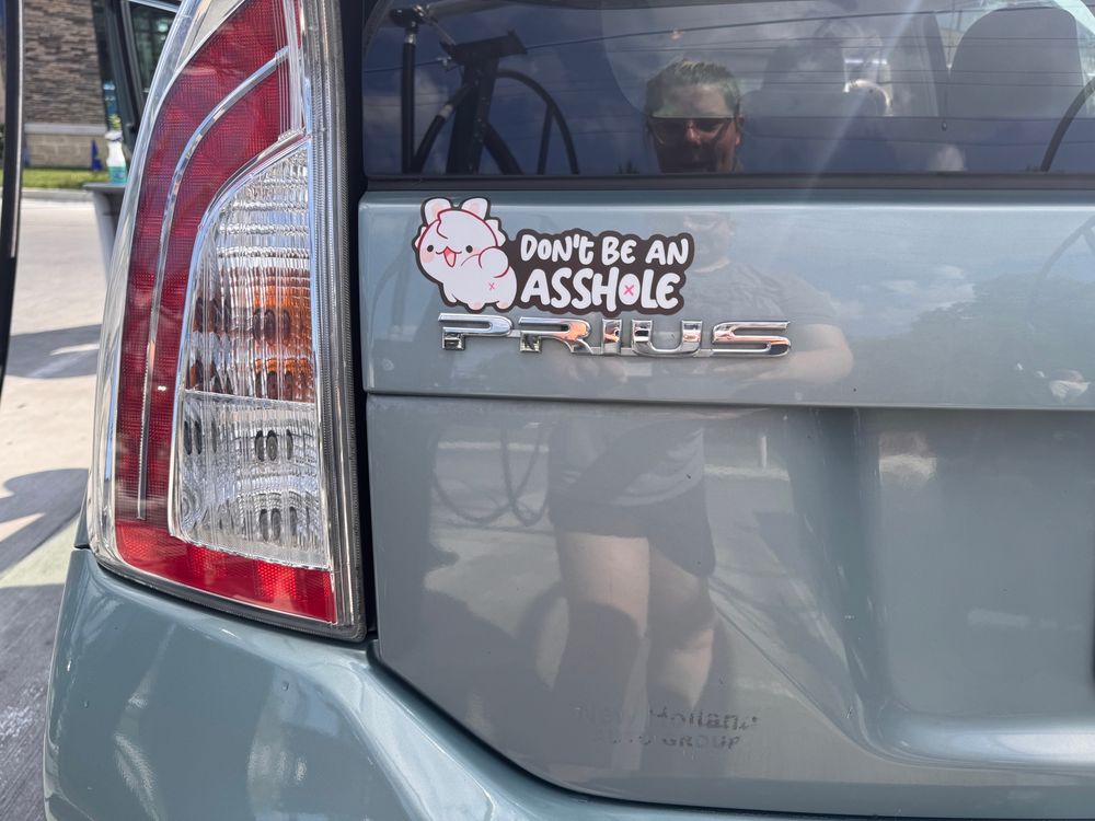 Done be an asshole bumper sticker. With a cute cat showing its asshole 