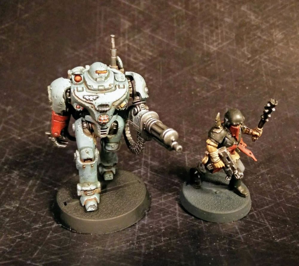 The UR-025 robot and a traitor guardsman from Blackstone Fortress. Painted UR in their classic pale grey/blue colour, with plenty of rust and scuff marks.