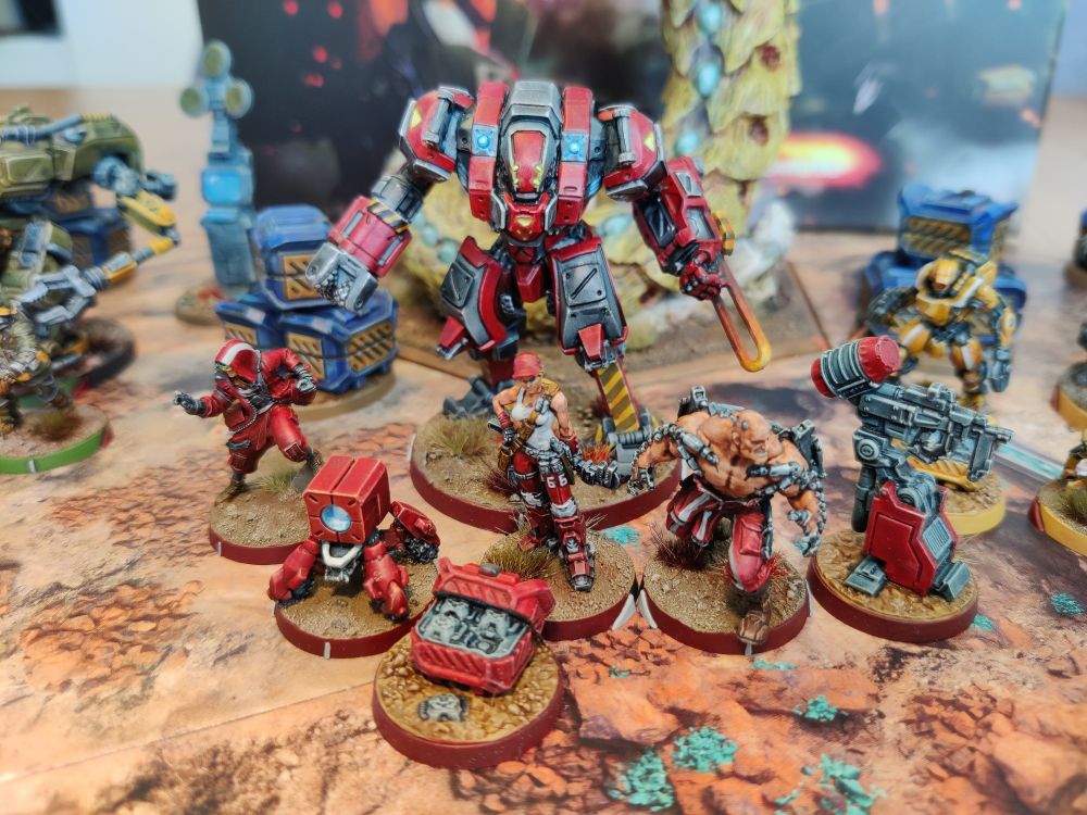 The Rocawork faction for TAG Raid. A large TAG (mech) and for support infantry, as well as some terrain pieces. 

Painted in a bright (some would say classic Nomad) red, with white and grey accents.