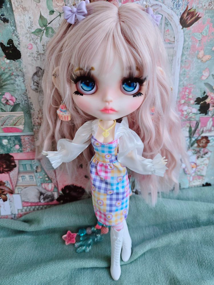 My pink-haired doll Everleigh in a colorful dress and tall boots posing with open arms