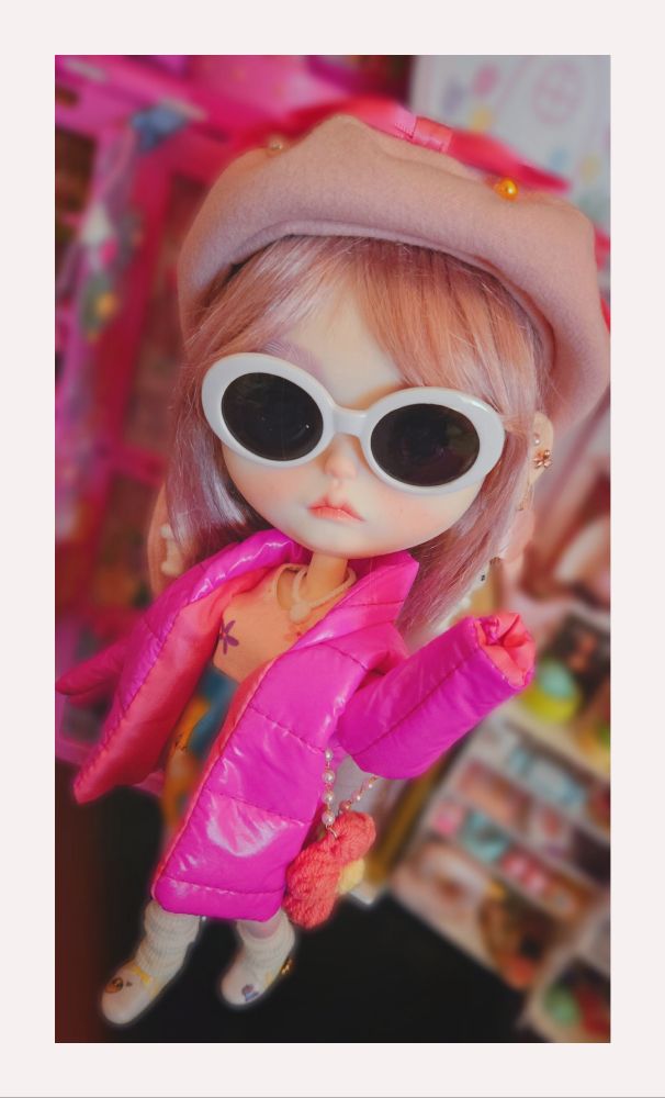 Full-body photo of the doll in mid-stride looking very cool and unbothered 
