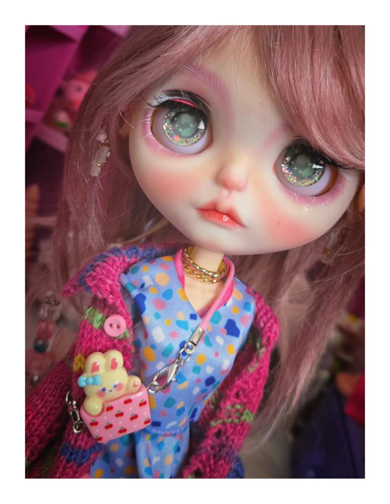 Closeup of the doll looking up with green eyes