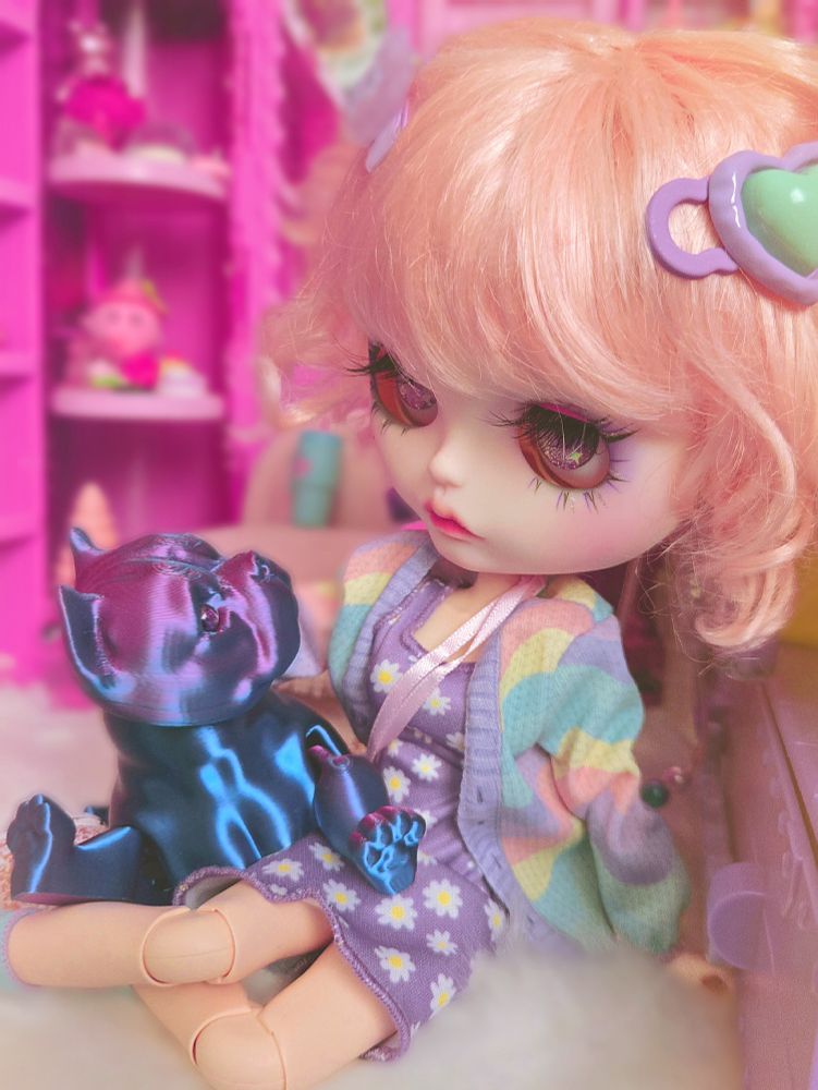 The doll and the dog looking at each other