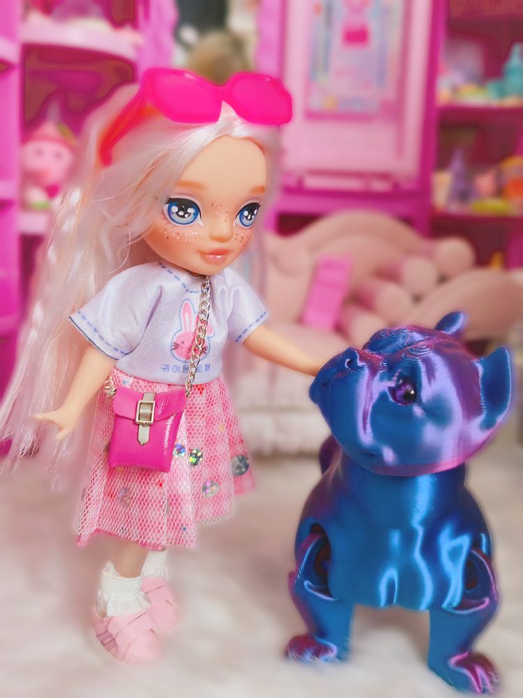 The doll and the dog looking at one another