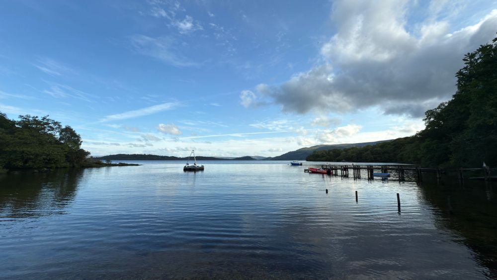 Loch Lomond at sunset with coring rig moored in sheltered bay at SCENE university of Glasgow research centre