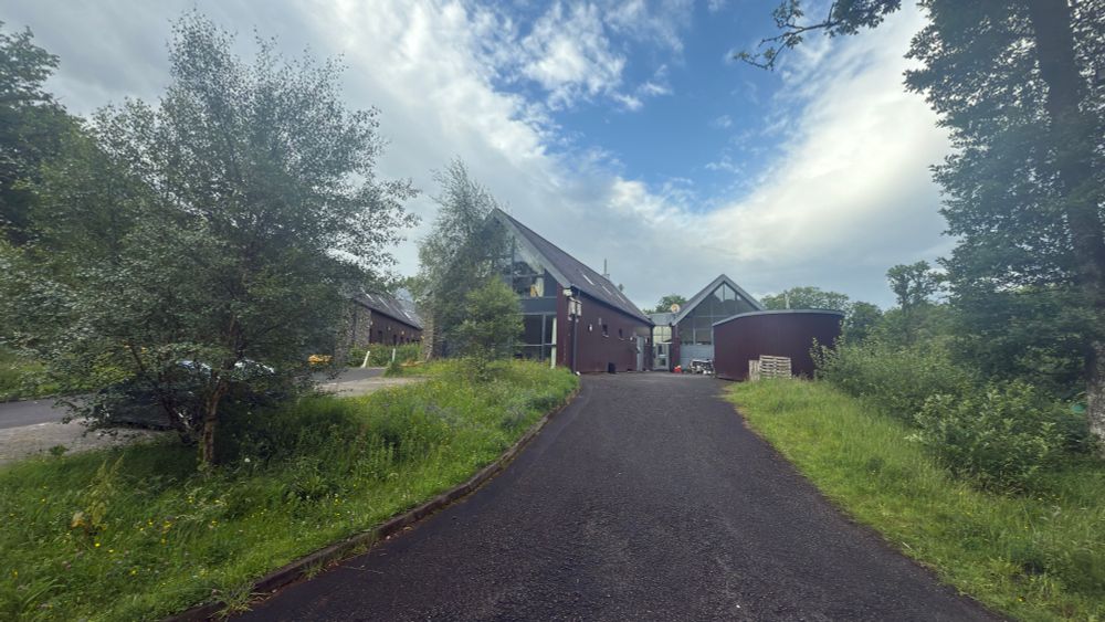 SCENE University of Glasgow research centre where we were based - photo shows the road leading up to the wooden building through the forest  