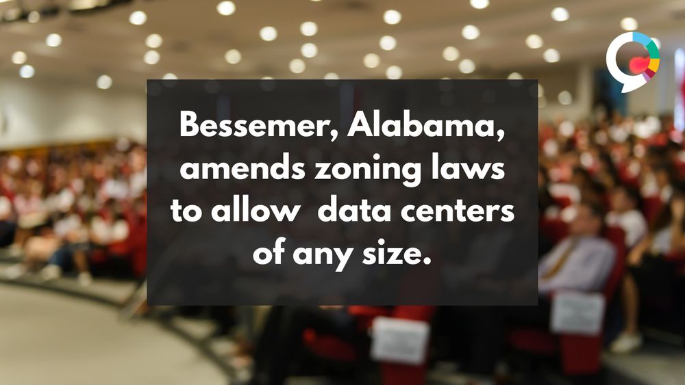 A faded image of people listening to a presentation with a text overlay reading: “Bessemer, Alabama, amends zoning laws to allow data centers of any size.”