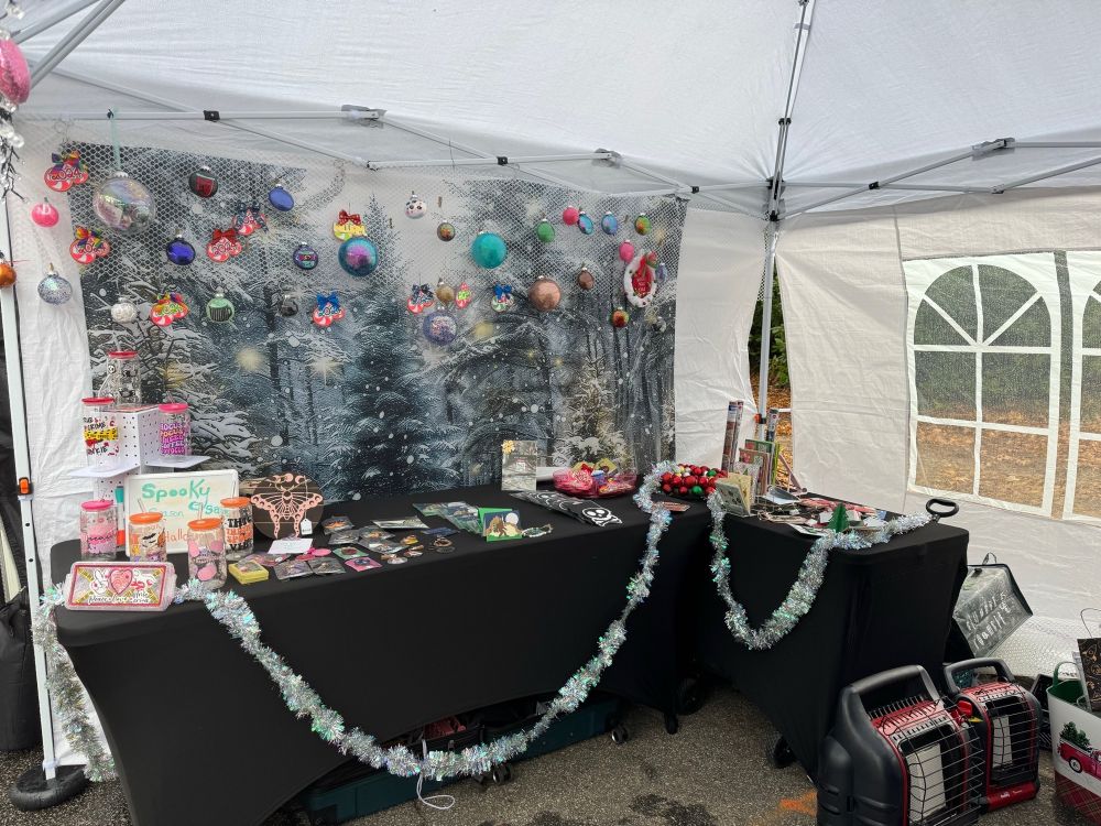 Ornaments, cups, and keychains arranged on the other side of the tent for this past Sunday’s event at Piedmont Park
