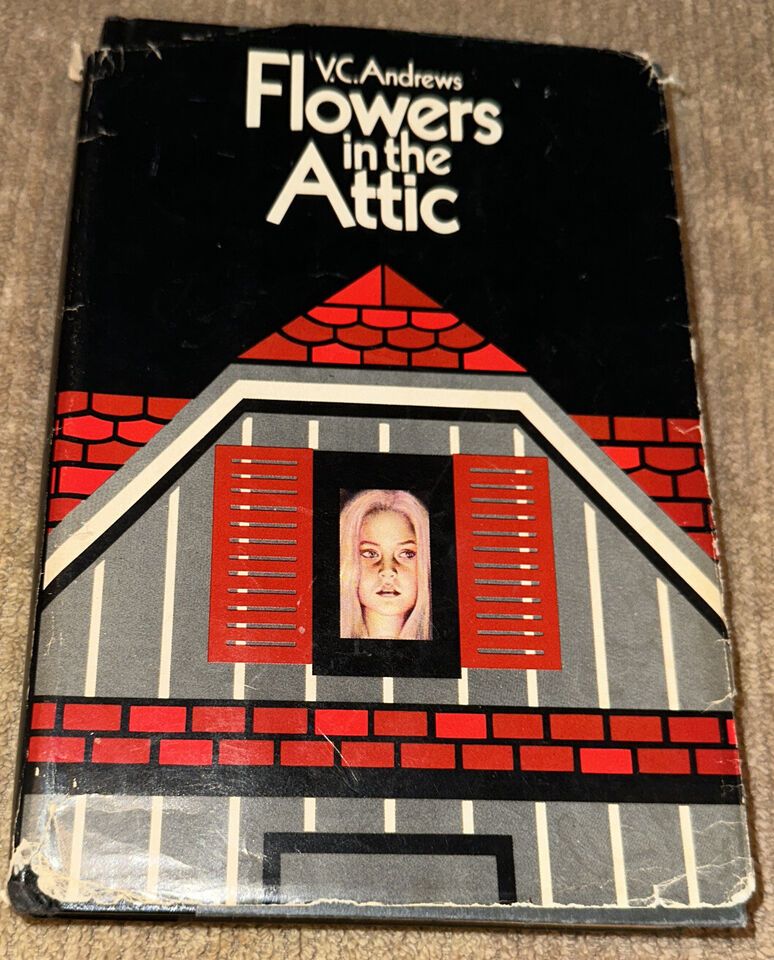 Book cover of Flowers in the Attic by VC Andrews. On a black background, a closeup of a gabled attic window with red shutters, matching the red roof. In the window, a closeup picture of a very pale white young woman with pale hair.