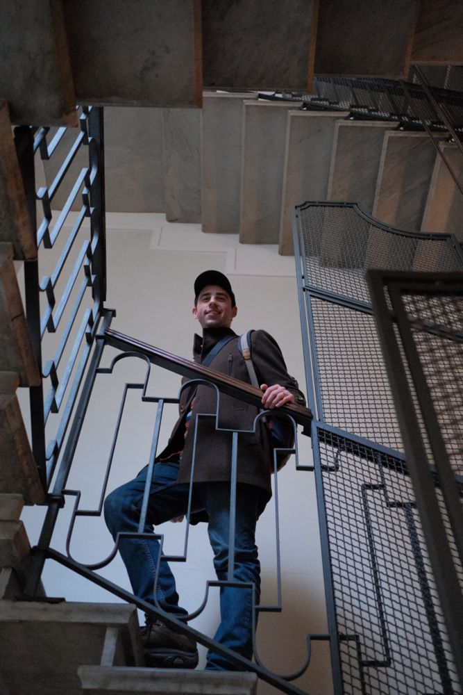 Standing on the other side of a staircase