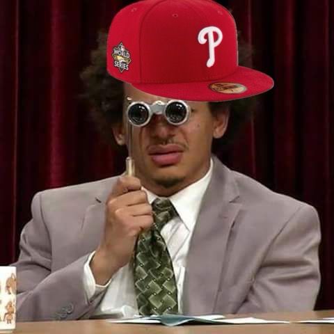 eric andre squints through opera glasses with a crude phillies hat