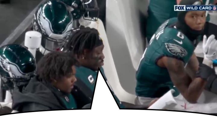 philadelphia eagles wr aj brown reads a book while sitting on the bench during the team’s 22-10 wild card round win over the green bay packers. there is a speech bubble to the quoted skeet.