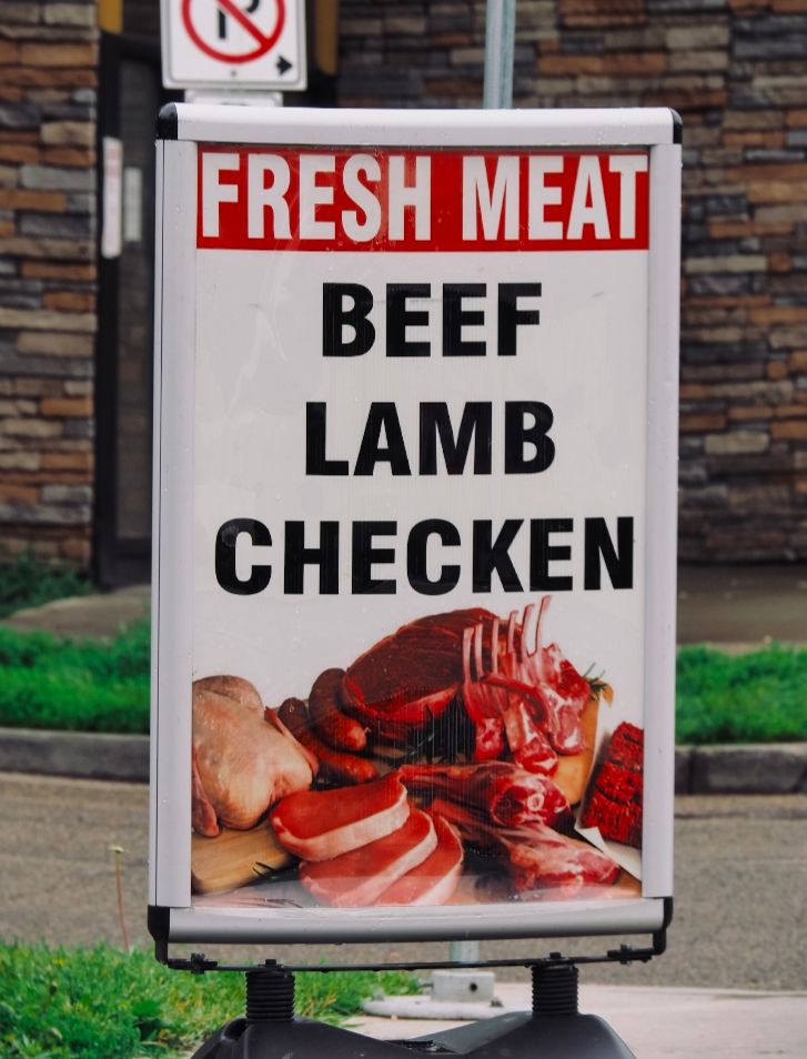 Sign that says fresh meat. Beef lamb checken