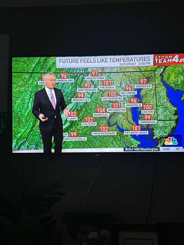 Weather man beside 100 degree temps 