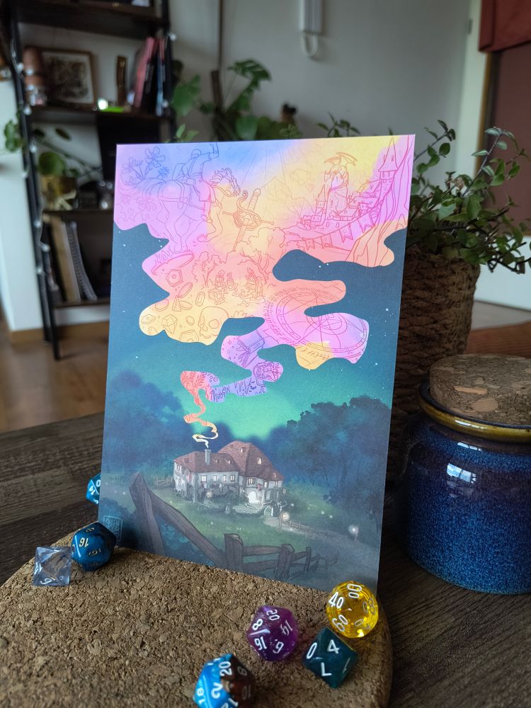 A photo of an A5 print of my DND artwork. It shows a tavern in a clearing in the woods, with colorful smoke coming from the chimney containing scenes from epic fantasy stories.