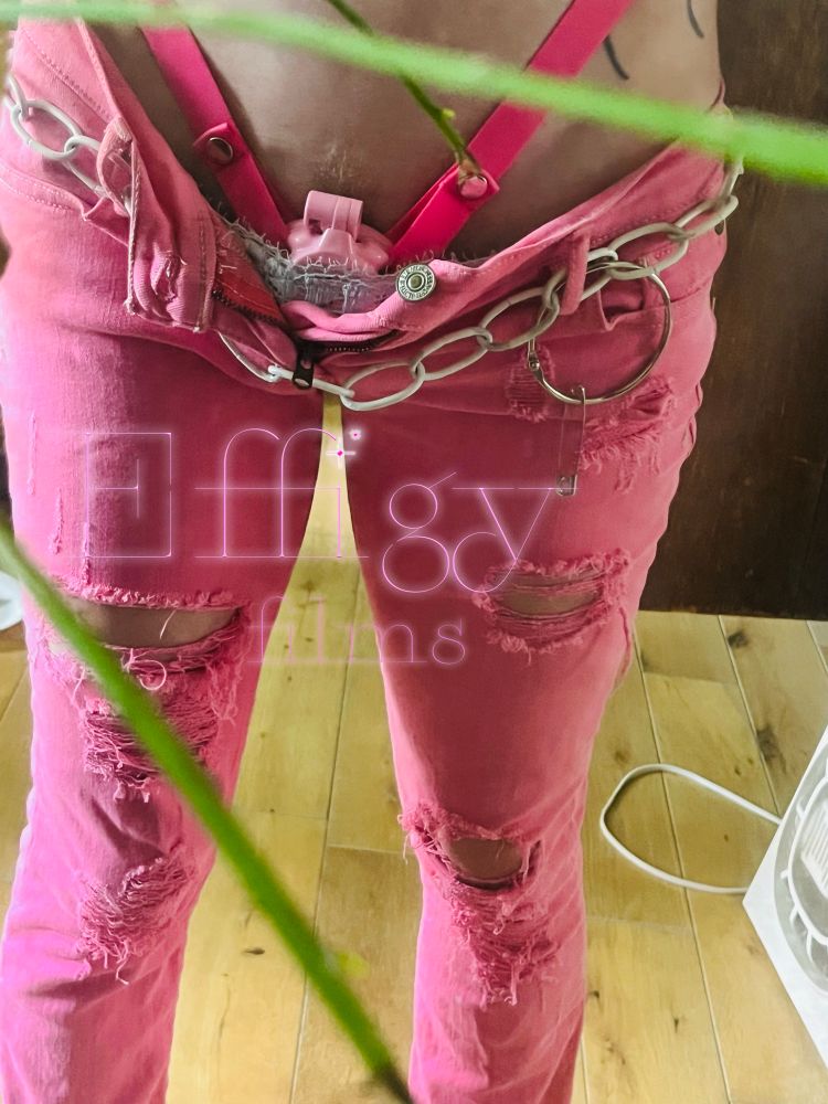 Star, from the hips down in unzipped ripped pink Abercrombie Jeans and a matching pink chastity belt hanging out ontop with lace in between them, around her hips is a hefty while chain with other hardware attached 