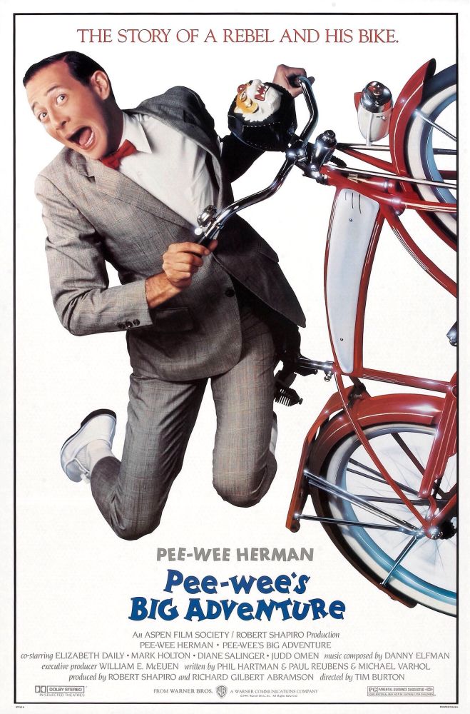 Theatrical movie poster for PEE-WEE’S BIG ADVENTURE (1985) featuring Paul Reubens as Pee-wee Herman riding his bicycle.