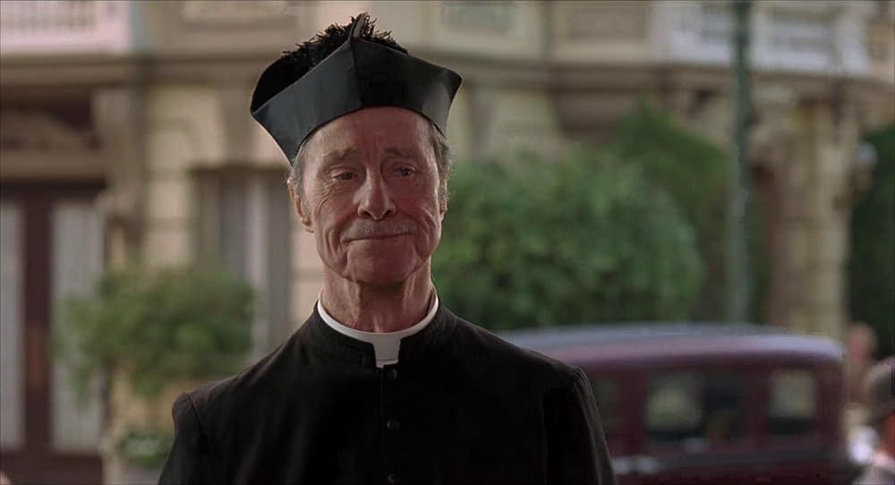 Don Ameche as Father Clemente in OSCAR (1991)