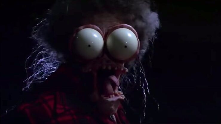 Large Marge transforms her face and bulges out her eyes in a grotesque fashion.
