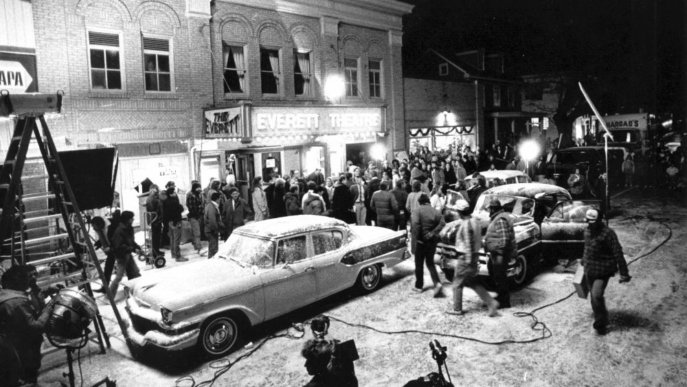 Filming for the movie "Dead Poets Society" outside the old Everett Theatre in Middletown. The Special Effects crew needed to make the location loom like it had snowed so they lined the street with crushed limestone and crushed marble and sprayed the sidewalks and trees with soap. 12/8/88
Photo By Jim Graham