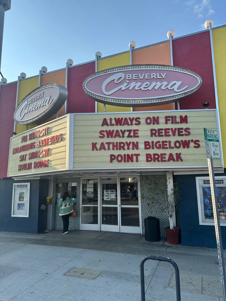 New Beverly Cinema with marquee text reading “Always on film. Swayze. Reeves. Kathryn Bigelow’s Point Break”