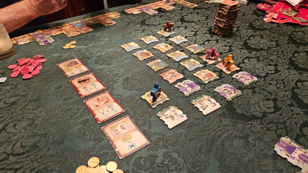 Mid-game table view of Middle Ages with tiles laid out.