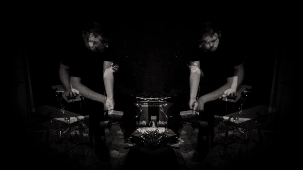 Photo of two percussionists performing. The image is multiple photos layered to give the impression of motion.