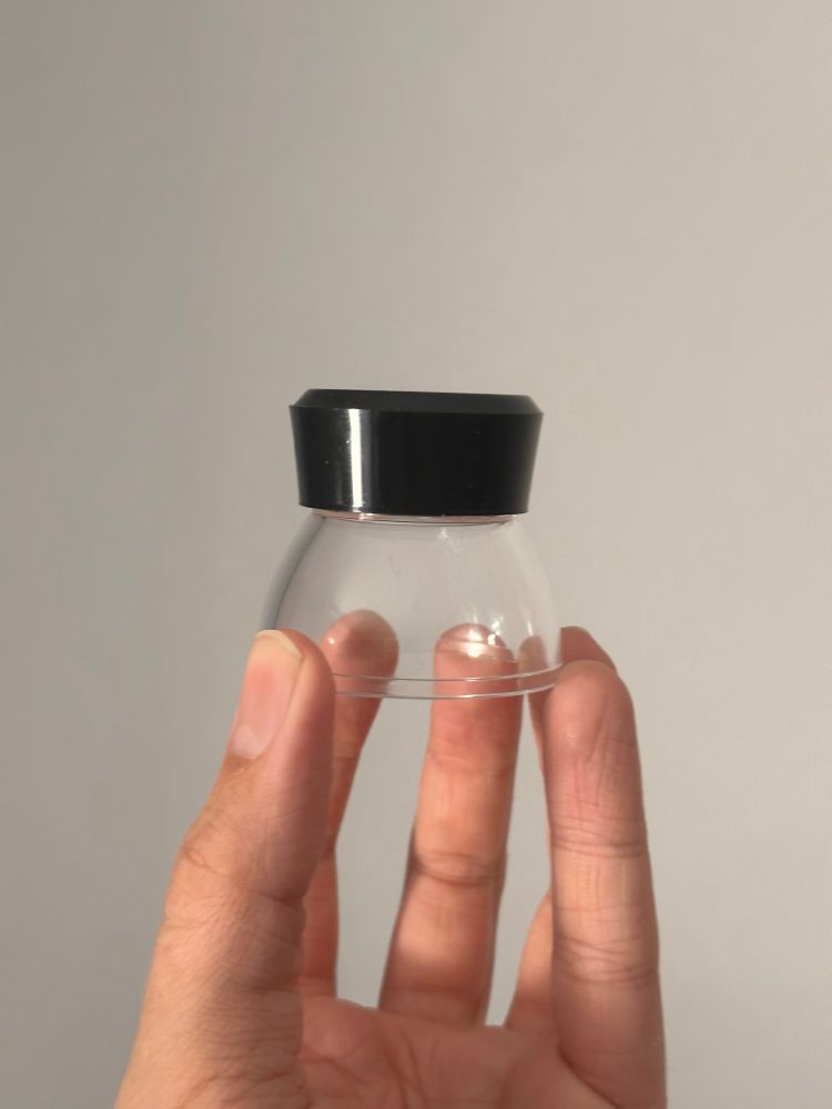 A small loupe. The kind used to inspect photographic negatives