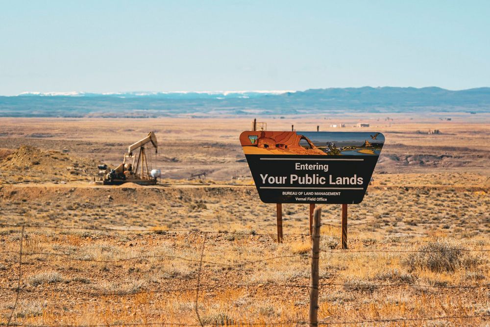 Sign in front of oil pump: Entering Your Public Lands