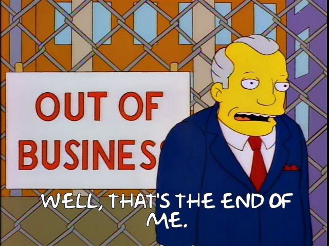 President of Duff brewery in front of an out of business sign saying 