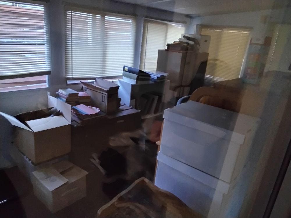 Piles of boxes in a room