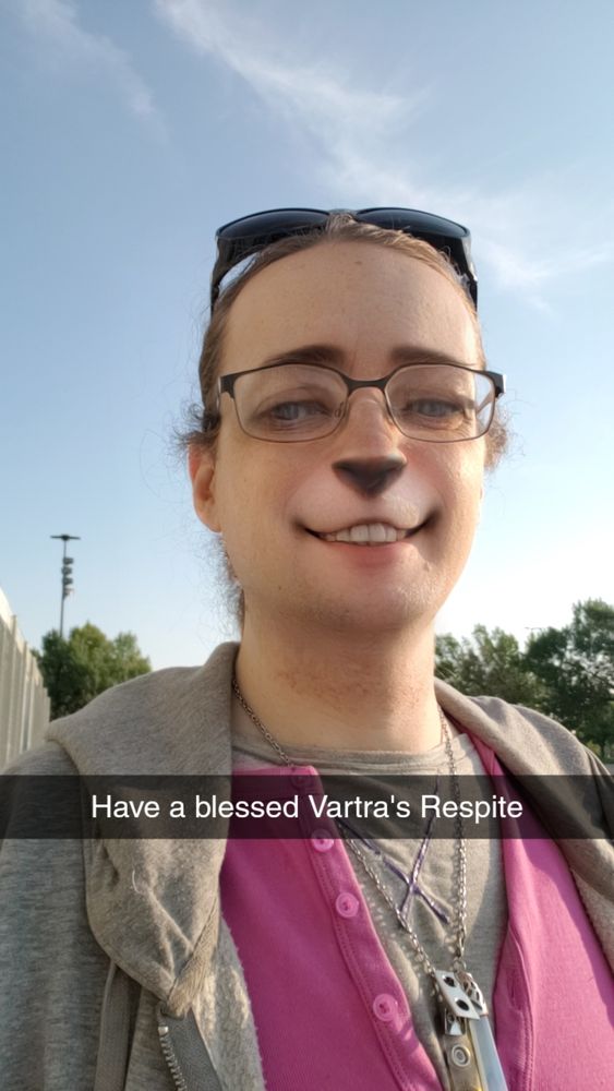 A photo of Ken with a cat face filter, and the caption have a blessed vartra's respite