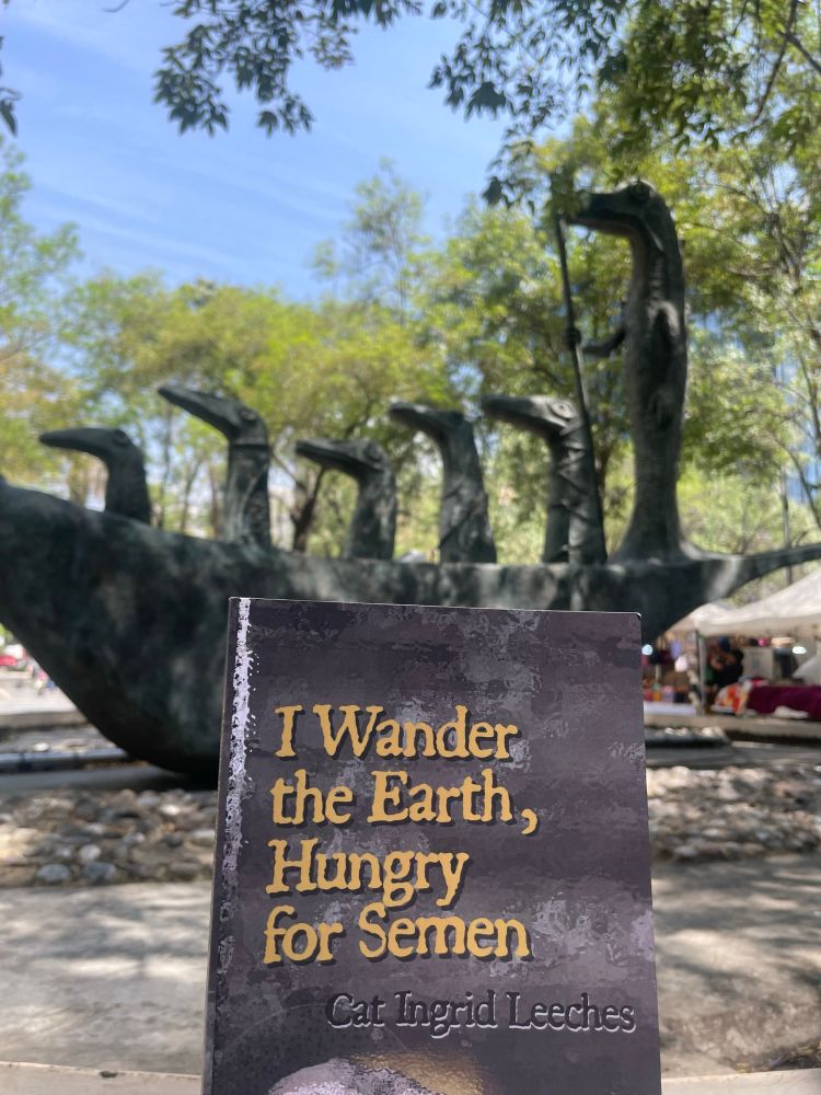 In the foreground: my book, I Wander the Earth, Hungry for Semen.
In the background: Leonora Carrington’s sculpture, Cocodrilo, in Mexico City. 
